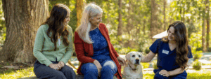 Premier Caregiver with Client and Dog